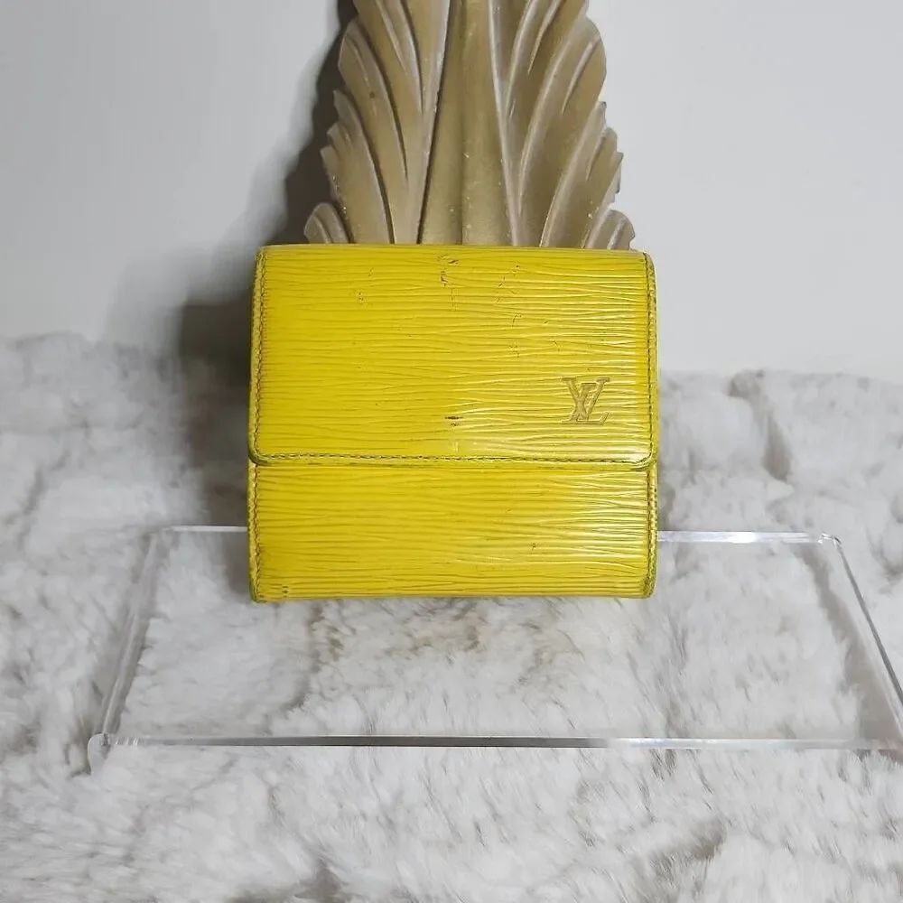 Louis Vuitton Elise Trifold Wallet crafted from their signature Tassil Yellow Ep